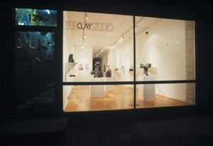 Photograph of The Clay Studio window with displayed ceramic objects
