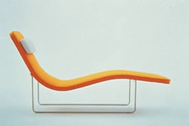 Photograph of an orange and yellow reclining seat on a metal frame